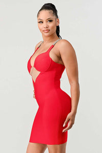 Red Bodycon Dress with Chain Straps: A bold red bodycon dress featuring chain straps and a plunging neckline with a sheer V-shaped cut-out. The dress is designed to hug the body, accentuating the figure.