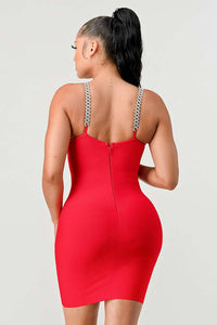 Red Dress with Sheer V Cut-Out and Chain Straps: An eye-catching red bodycon dress with a plunging neckline and a sheer V-shaped cut-out. The chain straps add a touch of glamour, perfect for a night out.