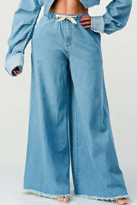 Introducing the "Breezy Blue Denim Palazzos," the perfect blend of comfort and style for your everyday wardrobe. These pants are a modern twist on classic denim, crafted with a relaxed and airy fit that echoes the free-spirited vibe of palazzo pants. The light wash denim fabric is soft and breathable, ensuring all-day comfort without sacrificing chic style.