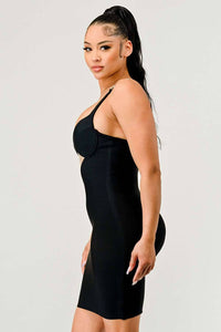 Plunging Black Dress with Metallic Straps: This elegant black dress showcases a plunging neckline, metallic chain straps, and a sheer cut-out at the waist. The bodycon fit emphasizes the curves for a sophisticated look.