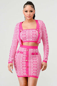 Pink and White Geometric Print Crop Top and Skirt Set: A vibrant two-piece set featuring a pink and white geometric print. The outfit includes a long-sleeve crop top with gold button accents and a matching high-waisted skirt with front button details.