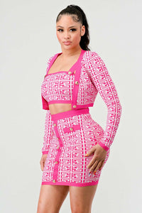 Bold Pink Geometric Print Matching Set: This stylish set includes a long-sleeve crop top and a high-waisted skirt, both adorned with a bold pink and white geometric pattern. Gold button accents add a touch of elegance to the ensemble.