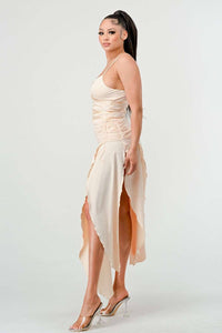 Elegant beige maxi dress with ruched detailing and side slit