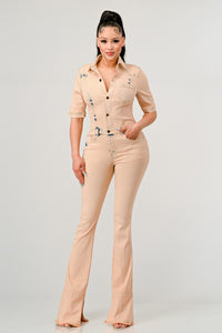 Elevate your style with the ATHINA Washed Denim Half Sleeve Jumpsuit. This jumpsuit features a vintage washed denim fabric that exudes a cool and laid-back vibe. The button-up front adds a touch of retro charm, while the fitted style highlights your curves in all the right places.<br data-mce-fragment="1">