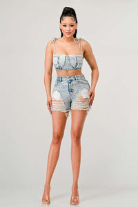 Eye-catching two-piece set with a cohesive distressed denim design.