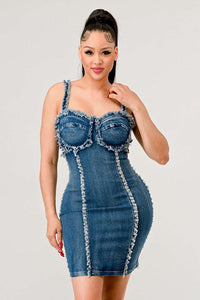 Fashionable woman in a distressed denim dress