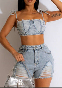 Rebel against the ordinary with our Denim Deconstructed Crop Top and Shorts Set, a bold take on classic denim that's both raw and refined. This set is for those who wear their individuality with pride, pairing comfort with an unapologetically edgy aesthetic.