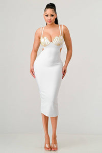 Elegant White Dress with Gold Embellished Bust: This elegant white dress showcases a bodycon fit with a gold studded bust. The dress includes double shoulder straps and side cut-outs for a sophisticated, stylish look.