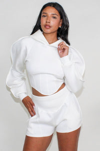 A chic modern white crop hoodie with bishop sleeves and coordinating high-rise shorts set.