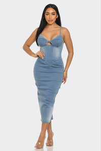 Woman wearing a blue denim bodycon dress with spaghetti straps