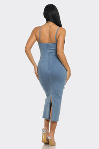 Blue denim dress with spaghetti straps and a body-hugging fit