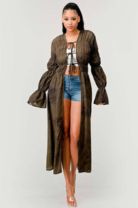 Sheer olive green duster cardigan with bell sleeves styled with denim shorts and a white top