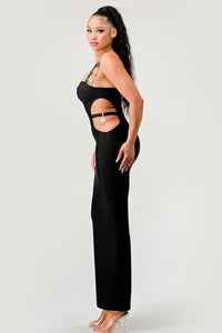 Sophisticated Black Maxi Dress with Cut-Outs and Gold Accents: An elegant black maxi dress with side cut-outs and gold accents on the straps. The fitted design emphasizes the silhouette, perfect for formal occasions.