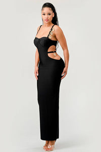 Black Bodycon Maxi Dress with Gold Strap Details: A stylish black bodycon maxi dress featuring side cut-outs and gold embellishments on the straps. The dress is designed to accentuate the figure and provide a sophisticated, modern style.