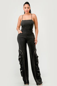 xperience the excitement of the open road with the Moto Mystique Jumpsuit. This fashion-forward piece embodies edginess and features a fitted bodice and slim straps leading into a high-waisted pant.