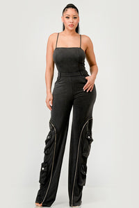 xperience the excitement of the open road with the Moto Mystique Jumpsuit. This fashion-forward piece embodies edginess and features a fitted bodice and slim straps leading into a high-waisted pant.